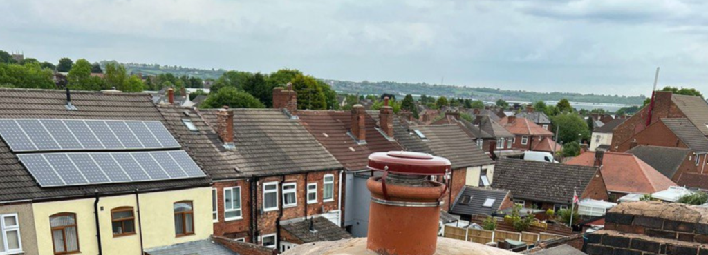 This is a photo taken from a roof which is being repaired by West Bridgford Roofing Repairs, it shows a street of houses, and their roofs